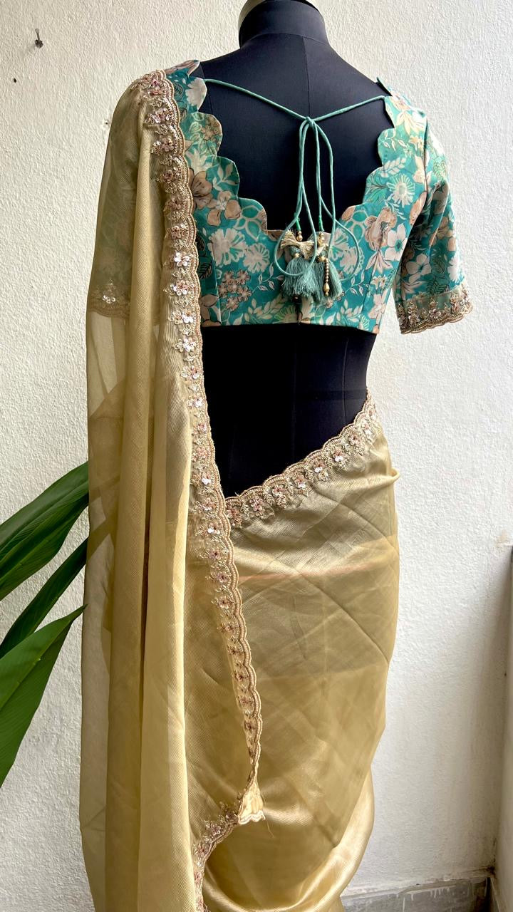 Golden soft tissue saree with blue floral embroidery blouse
