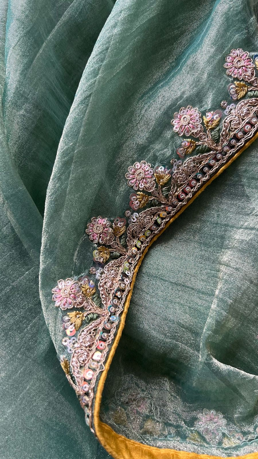 Light green soft tissue saree with golden banarasi blouse