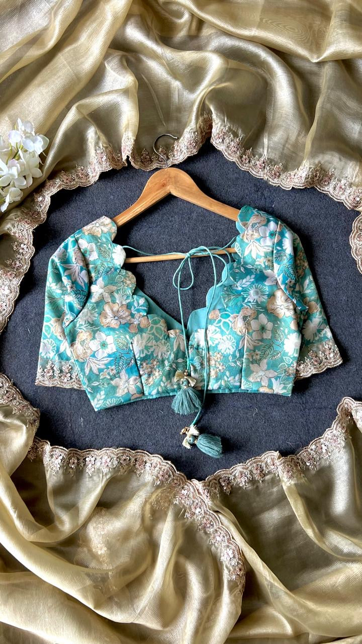 Golden soft tissue saree with blue floral embroidery blouse