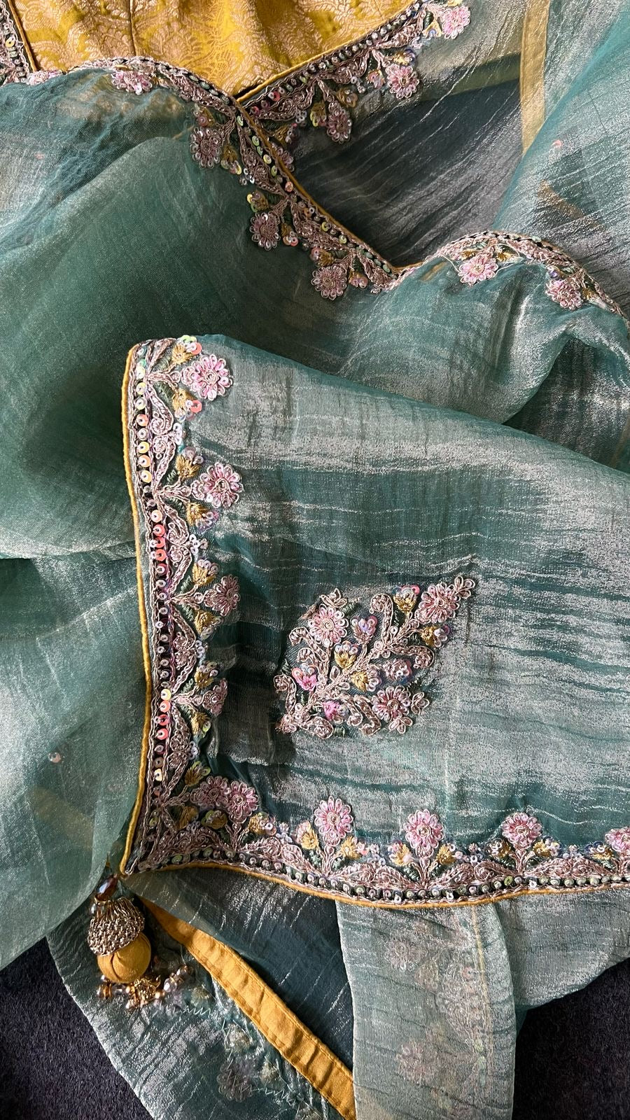 Light green soft tissue saree with golden banarasi blouse