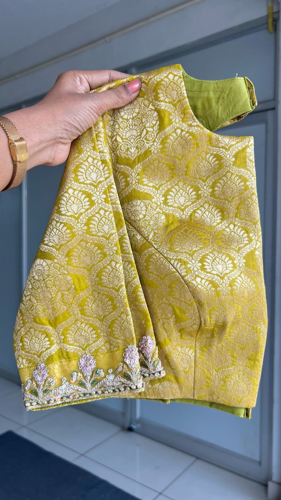 Light green soft tissue saree with golden banarasi blouse