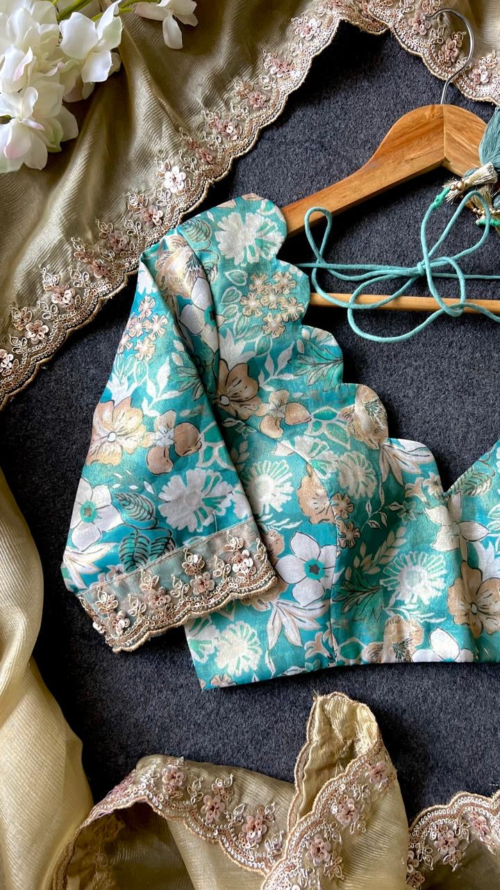 Golden soft tissue saree with blue floral embroidery blouse