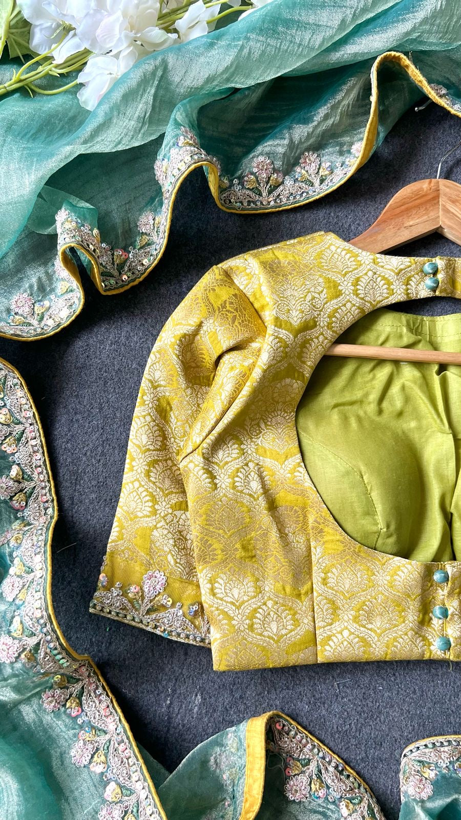 Light green soft tissue saree with golden banarasi blouse