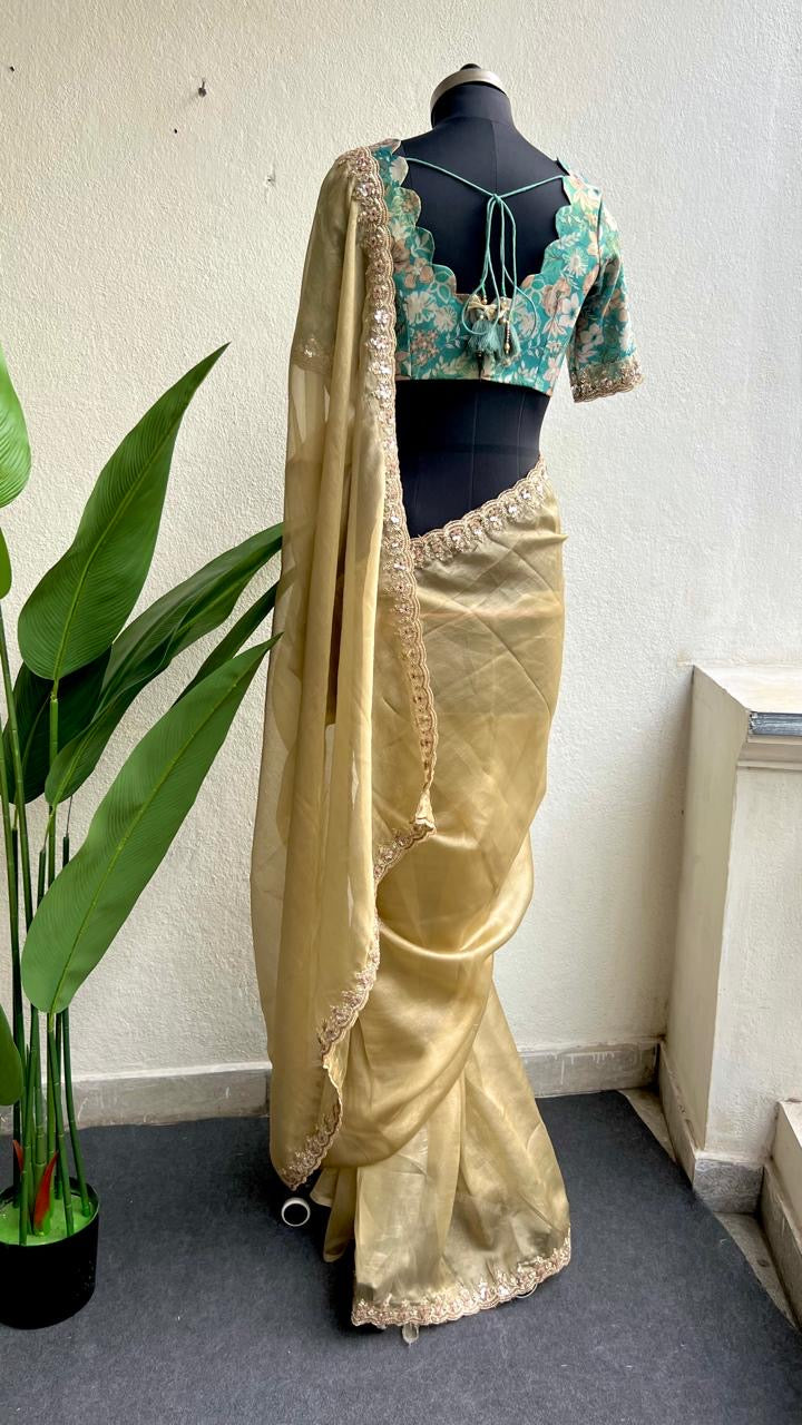 Golden soft tissue saree with blue floral embroidery blouse