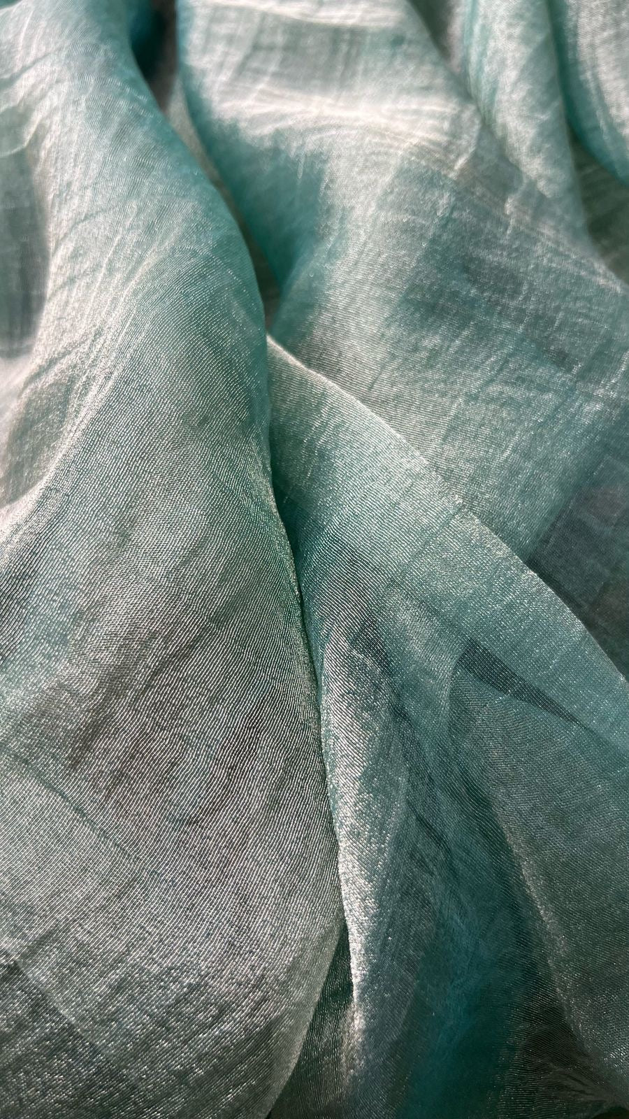Light green soft tissue saree with golden banarasi blouse