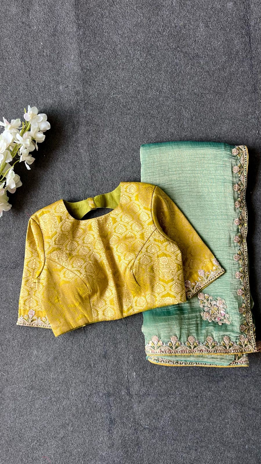 Light green soft tissue saree with golden banarasi blouse