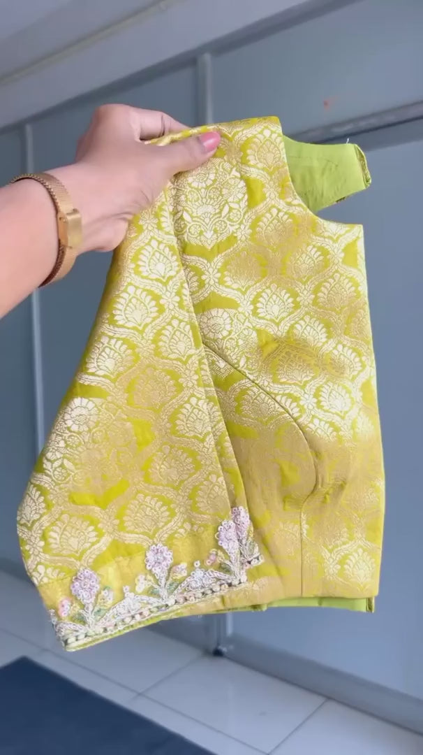 Light green soft tissue saree with golden banarasi blouse
